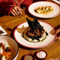 Three dishes sit on a table at East End Cellars 